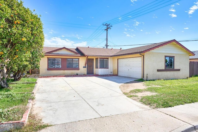 ranch-style house featuring a garage, driveway, fence, a front lawn, and stucco siding