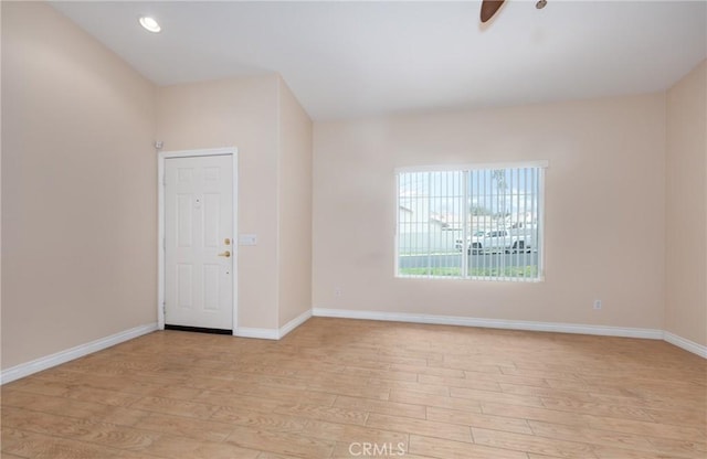 unfurnished room with ceiling fan, light wood finished floors, recessed lighting, and baseboards