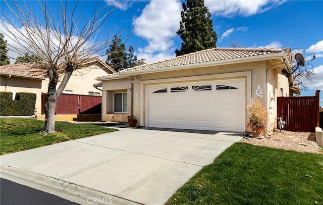 ranch-style home featuring a garage, concrete driveway, a tile roof, fence, and stucco siding