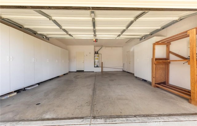 garage featuring secured water heater and a garage door opener