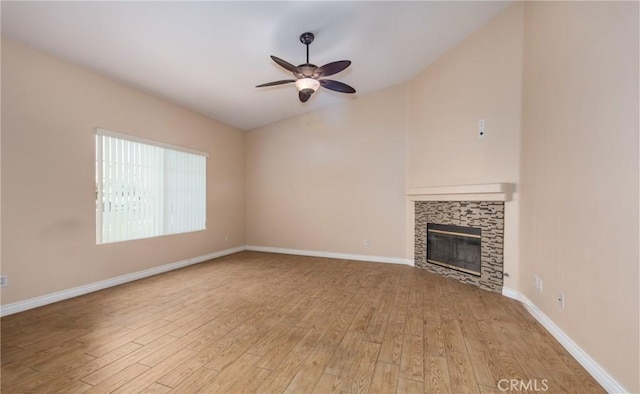 unfurnished living room featuring light wood-style floors, a fireplace, and baseboards