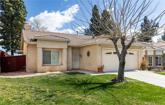 view of front of house featuring an attached garage, a tile roof, a front yard, and stucco siding