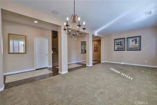 interior space featuring carpet floors, visible vents, stairway, and baseboards