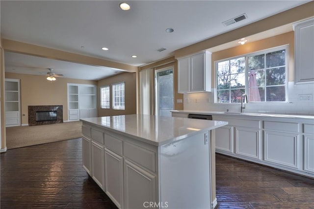 1230 Cantania Dr, Redlands, CA 92374 - kitchen featuring ceiling fan, dark wood finished floors, recessed lighting, tasteful backsplash, and a sink