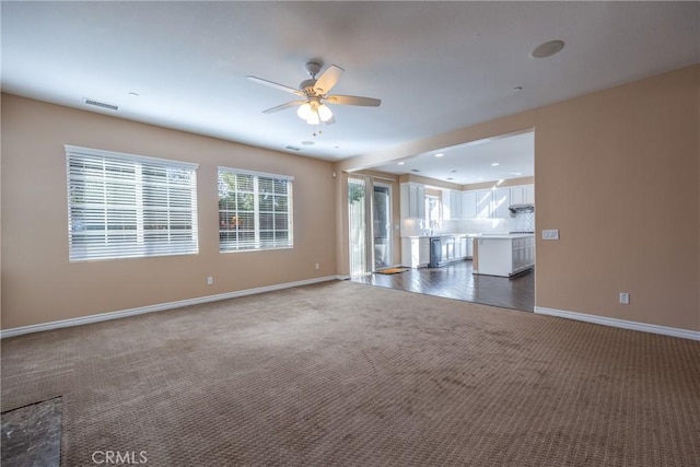 1230 Cantania Dr, Redlands, CA 92374 - spare room featuring dark carpet and a ceiling fan