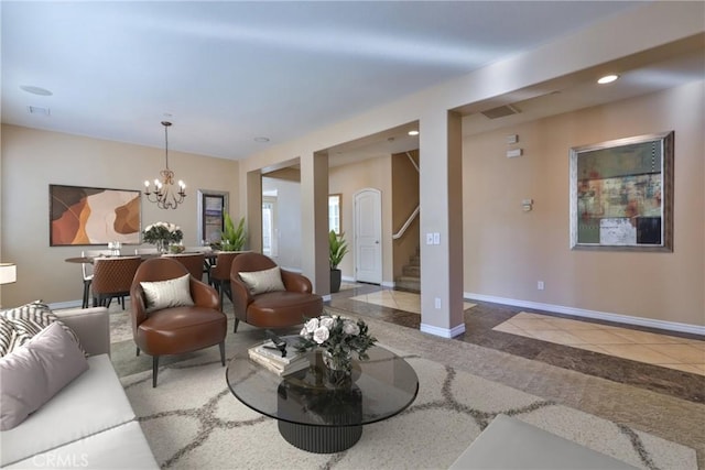 living area with recessed lighting, a notable chandelier, baseboards, stairs, and tile patterned floors