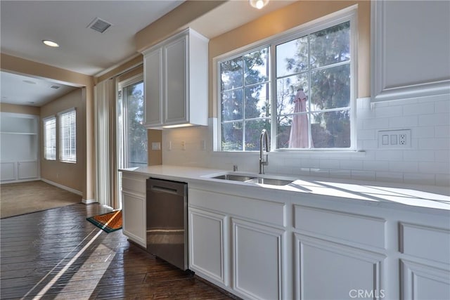 1230 Cantania Dr, Redlands, CA 92374 - kitchen featuring stainless steel dishwasher, tasteful backsplash, light countertops, white cabinets, and dark wood-style flooring