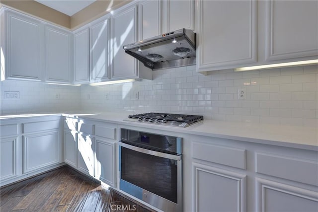 1230 Cantania Dr, Redlands, CA 92374 - kitchen featuring ventilation hood, appliances with stainless steel finishes, light countertops, and decorative backsplash