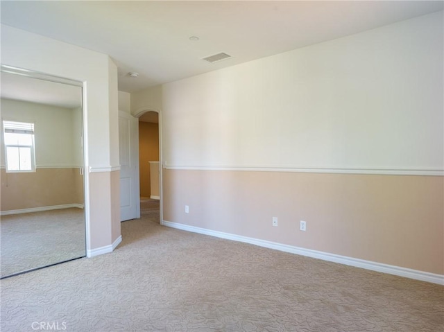 1230 Cantania Dr, Redlands, CA 92374 - unfurnished bedroom featuring arched walkways, carpet, and baseboards