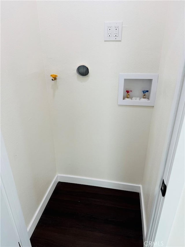 laundry room with baseboards, washer hookup, and wood finished floors