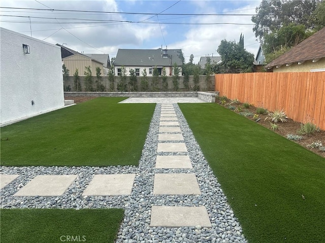 view of yard featuring a fenced backyard