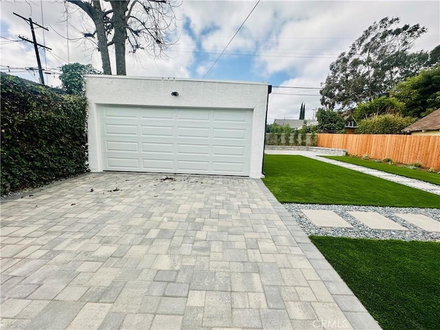 garage featuring fence