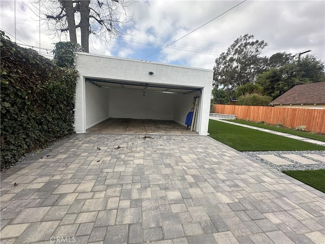 garage featuring fence