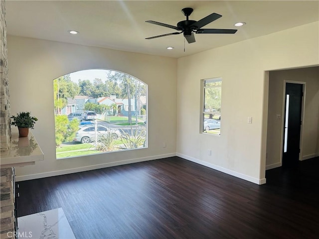 spare room with recessed lighting, baseboards, dark wood finished floors, and ceiling fan