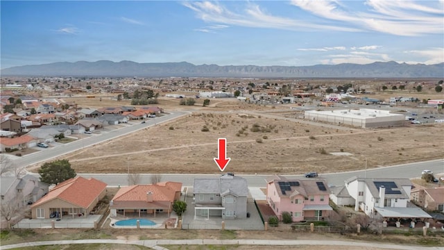 drone / aerial view with a residential view and a mountain view