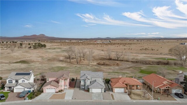 view of mountain feature featuring view of desert and a residential view
