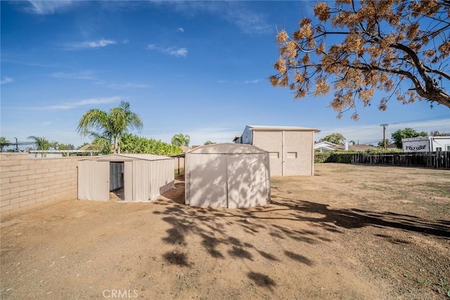 view of shed with fence