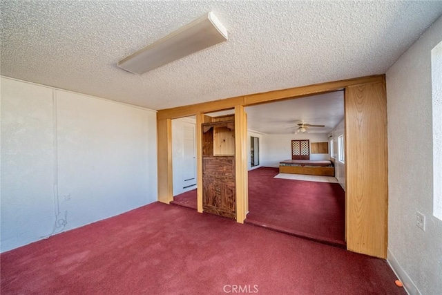 unfurnished bedroom featuring carpet floors and a textured ceiling