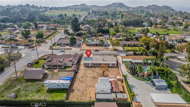 birds eye view of property featuring a mountain view