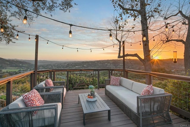 wooden deck with outdoor lounge area