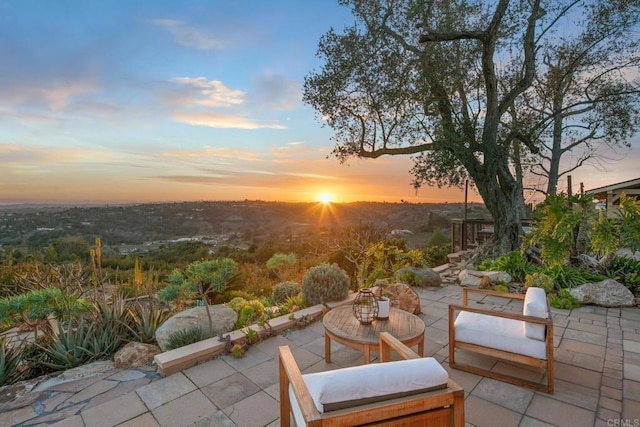 view of patio terrace at dusk