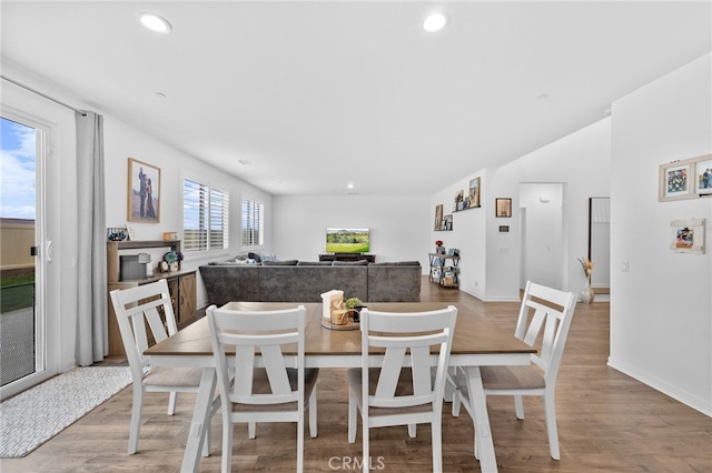 dining area featuring recessed lighting and light wood-style flooring