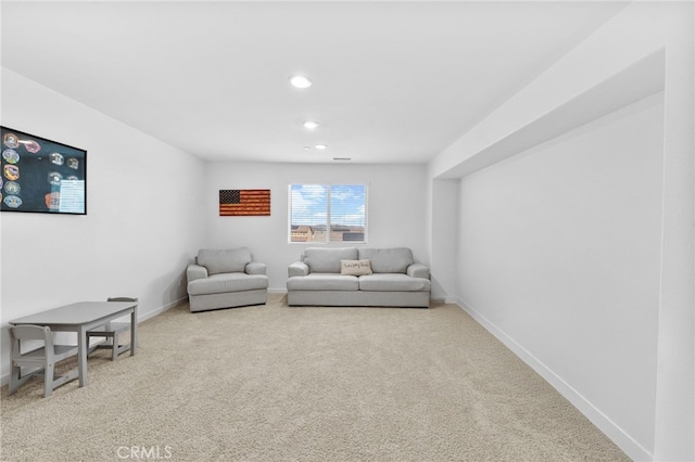 living area with carpet floors, recessed lighting, and baseboards