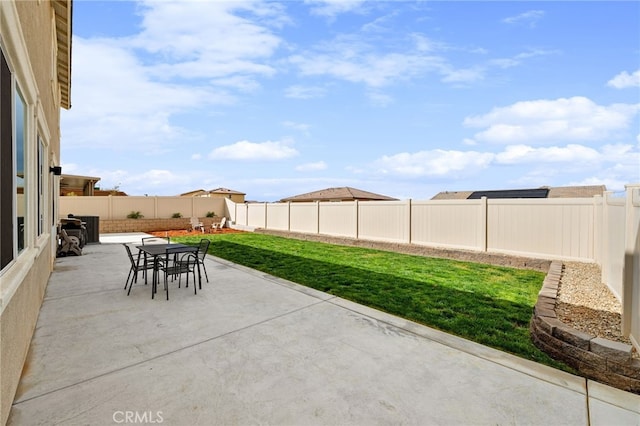 view of patio / terrace featuring outdoor dining area and a fenced backyard