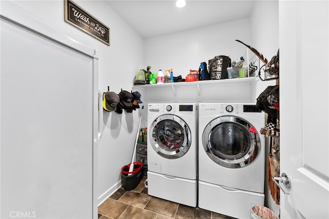 laundry room with laundry area and washing machine and clothes dryer