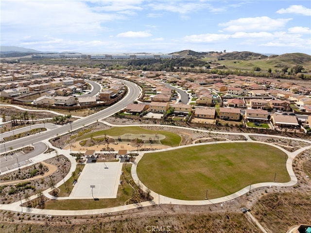 birds eye view of property with a mountain view and a residential view