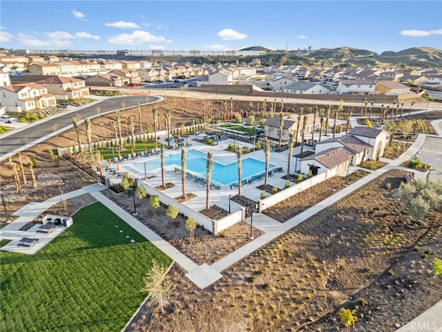 view of swimming pool with a mountain view and a residential view