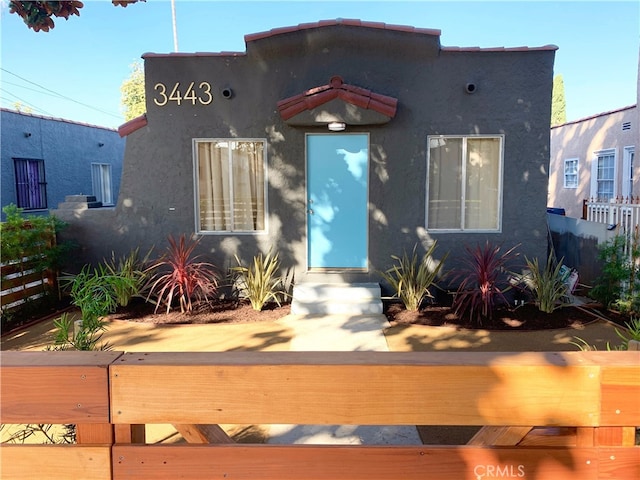 3443 W Blvd, Los Angeles, CA 90016 - mediterranean / spanish house featuring stucco siding and fence