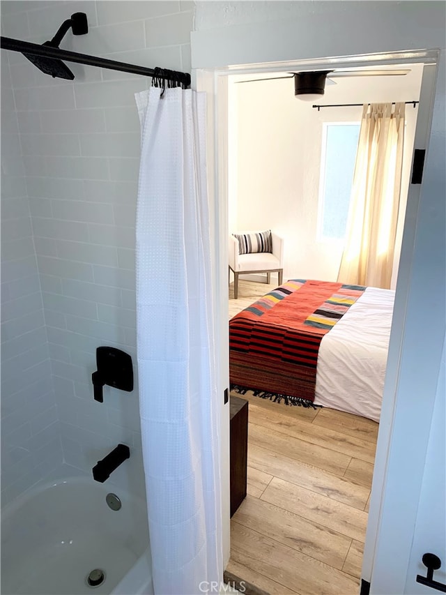 full bathroom featuring shower / bath combination with curtain and wood finished floors