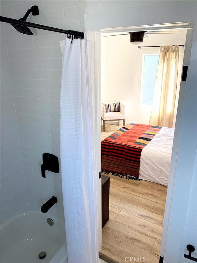 3443 W Blvd, Los Angeles, CA 90016 - bathroom featuring wood finished floors and shower / tub combo