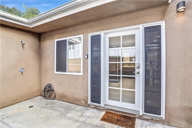 309 W Avenida Palizada, San Clemente, CA 92672 - view of exterior entry with a patio area and stucco siding
