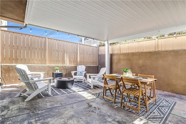 309 W Avenida Palizada, San Clemente, CA 92672 - view of patio featuring an outdoor fire pit, outdoor dining area, and a fenced backyard