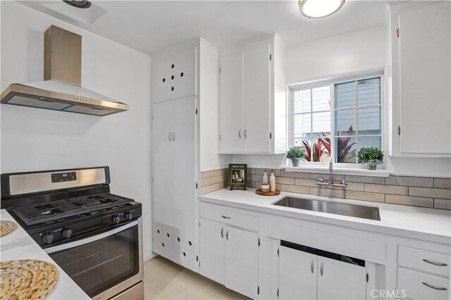 309 W Avenida Palizada, San Clemente, CA 92672 - kitchen with light countertops, a sink, wall chimney range hood, and gas range
