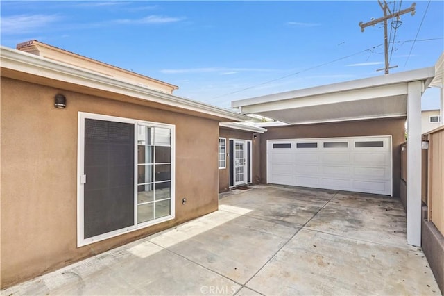 309 W Avenida Palizada, San Clemente, CA 92672 - view of side of property with a garage, concrete driveway, and stucco siding