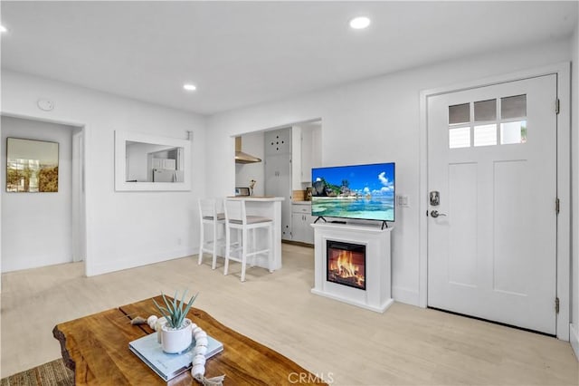 309 W Avenida Palizada, San Clemente, CA 92672 - living area featuring light wood-type flooring, recessed lighting, and a glass covered fireplace