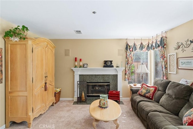 living room with visible vents, light carpet, baseboards, and a premium fireplace