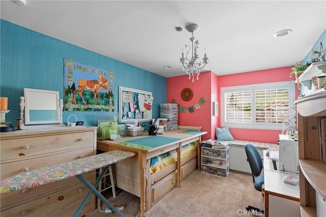 office area with light carpet, a textured ceiling, and a chandelier