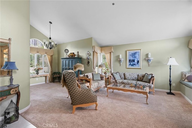 carpeted living area featuring high vaulted ceiling, baseboards, and a notable chandelier