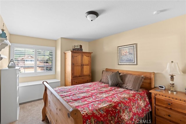 bedroom with light colored carpet