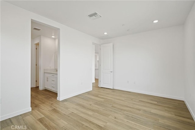 unfurnished bedroom with light wood-style floors, baseboards, visible vents, and recessed lighting