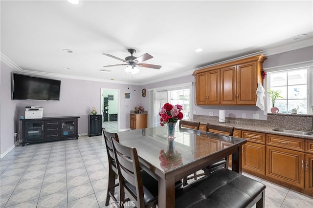 interior space featuring baseboards, recessed lighting, a ceiling fan, and crown molding