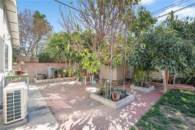 view of patio / terrace featuring ac unit and fence