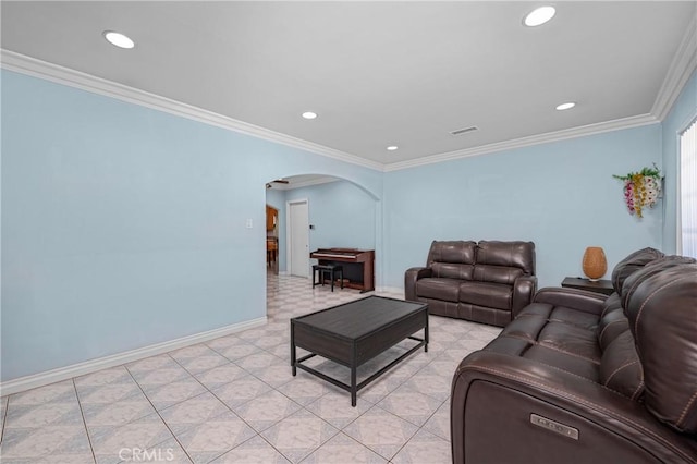 living area featuring arched walkways, crown molding, recessed lighting, visible vents, and baseboards