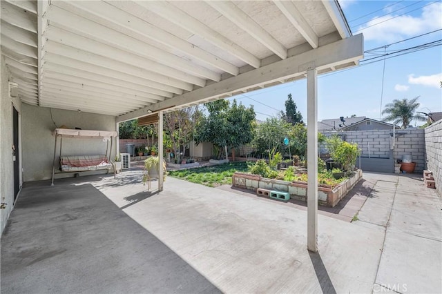 view of patio featuring a fenced backyard and a vegetable garden