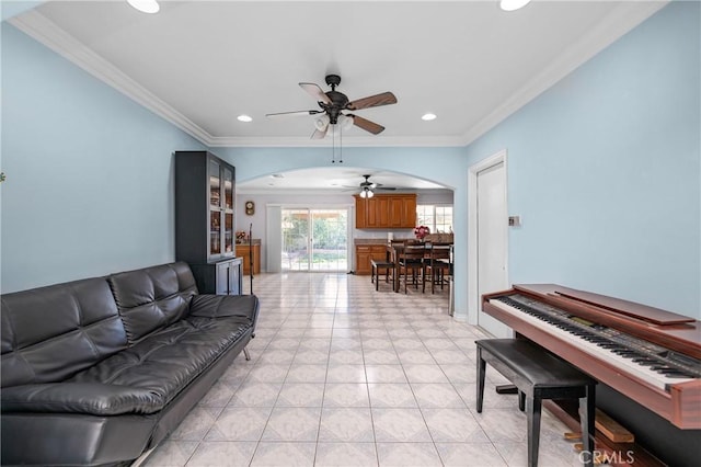 living room with recessed lighting, arched walkways, ceiling fan, crown molding, and light tile patterned flooring