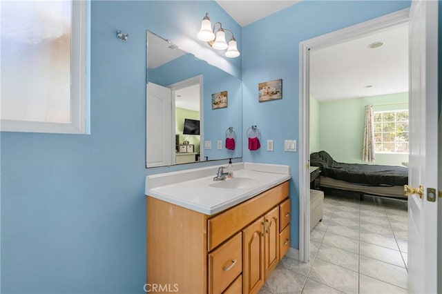 bathroom featuring tile patterned flooring, connected bathroom, and vanity